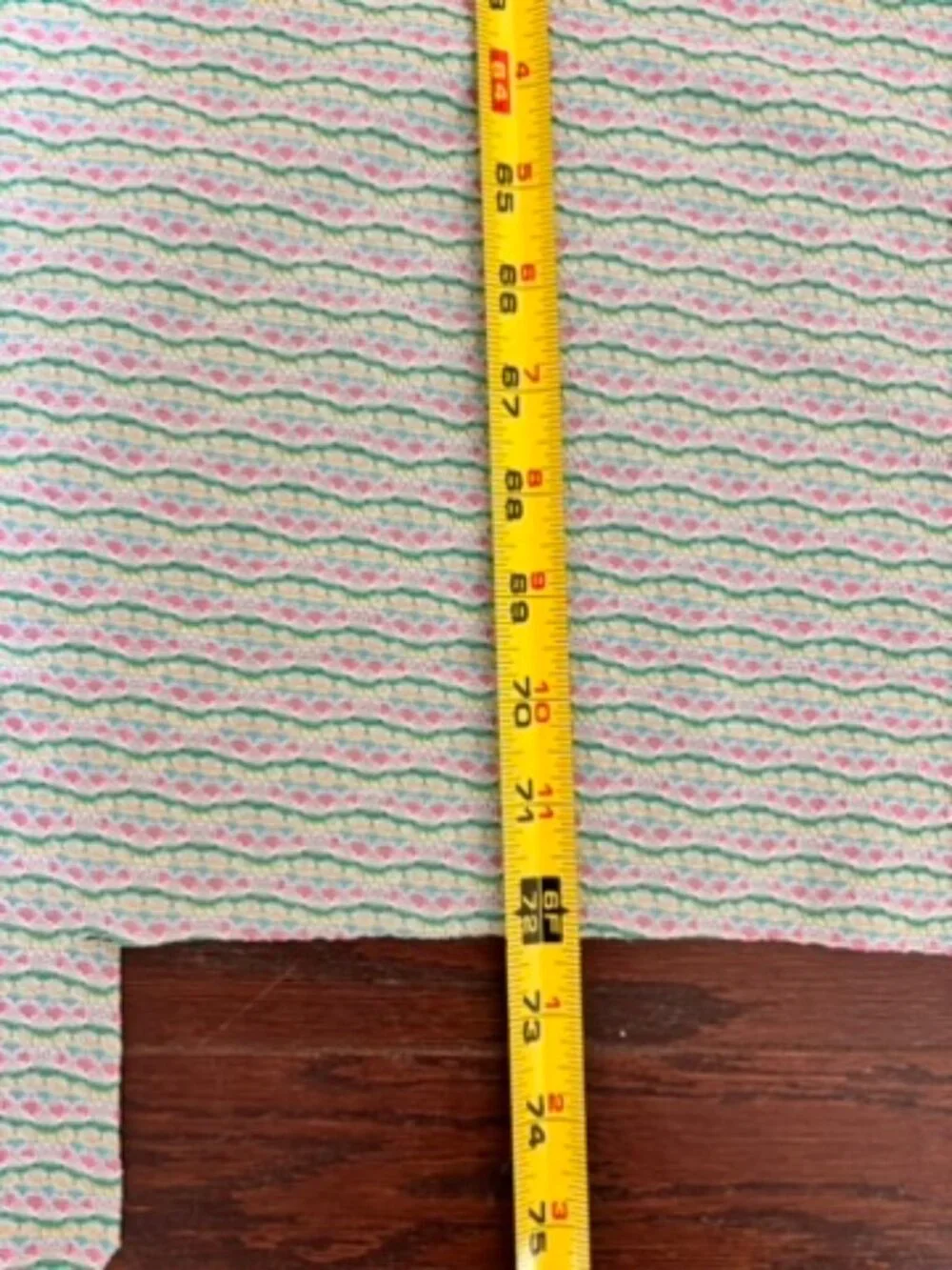 Multicolor wavy striped knit fabric with repeating pattern of pastel lines